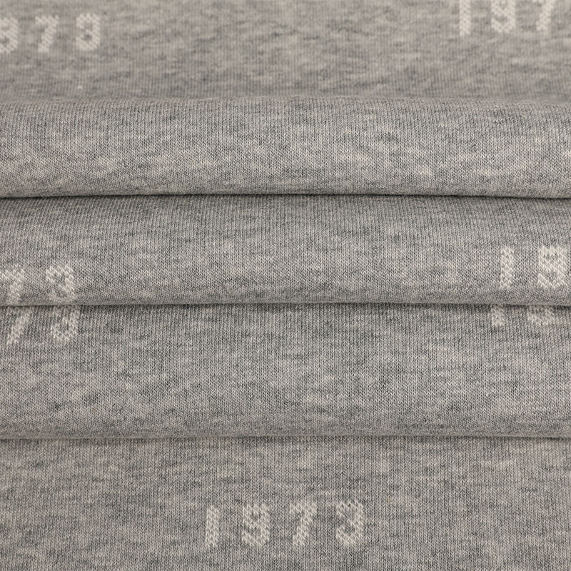 32s Celese + 100D/36F återvunnen polyester + 10s Celese Jacquard Fleecetyg